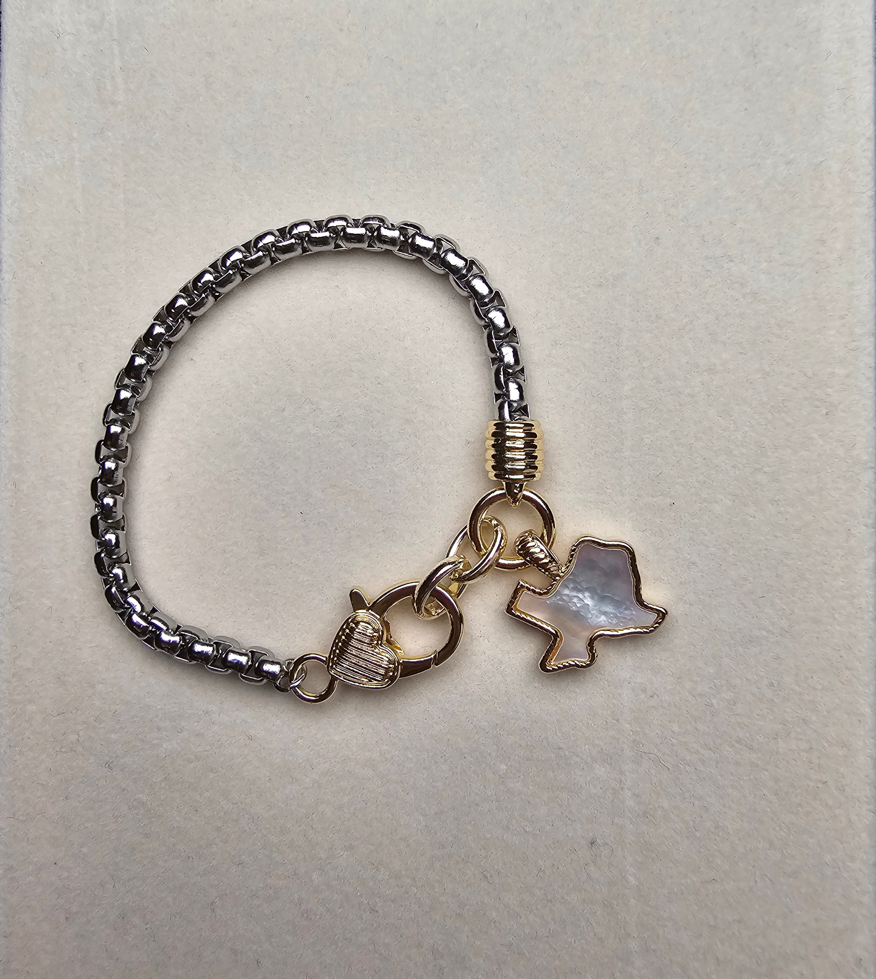 Bracelet with Texas charm on a light gray background