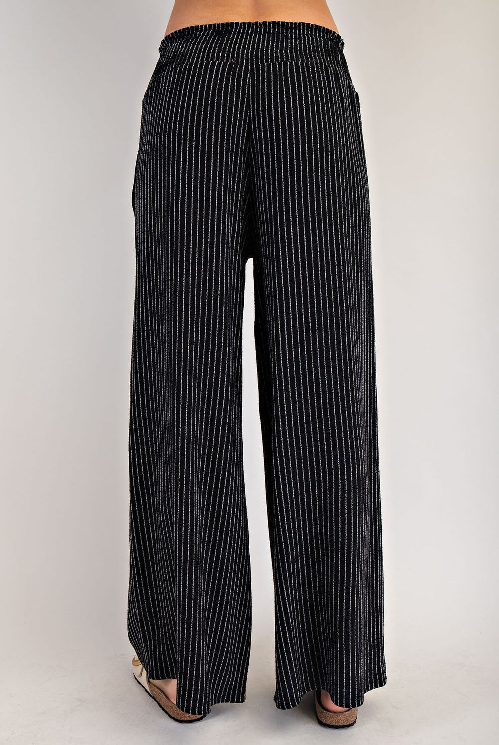 Black vertical pinstripe drawstring straight-leg pants, front view