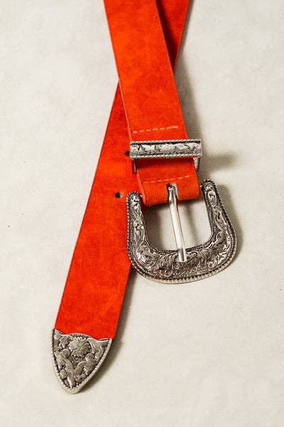 Red belt with silver buckle and decorative ends on a beige background