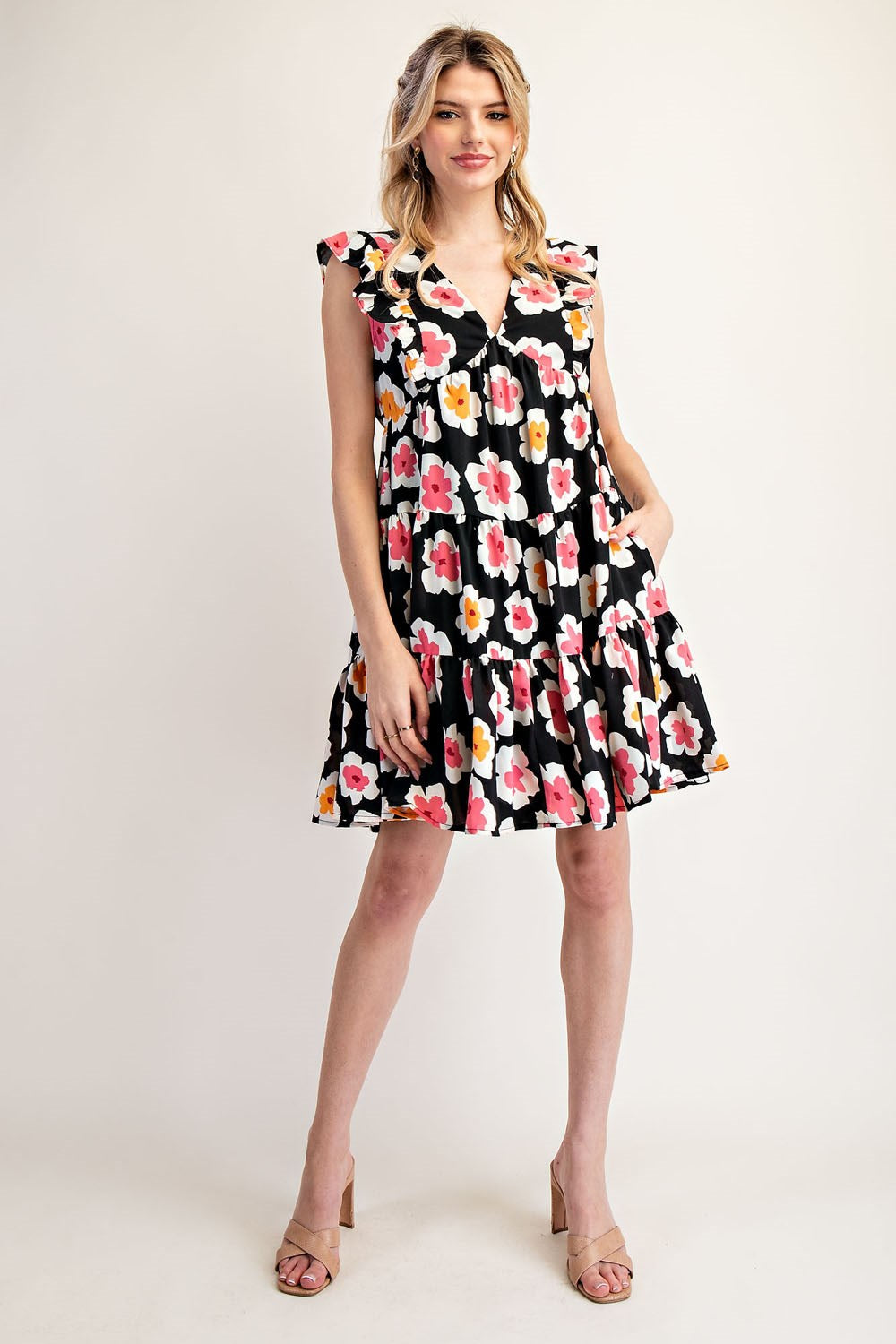 Woman wearing a floral dress on a white background