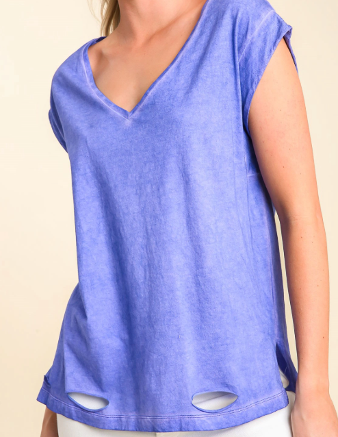 Blue sleeveless top with cut-out details on a beige background