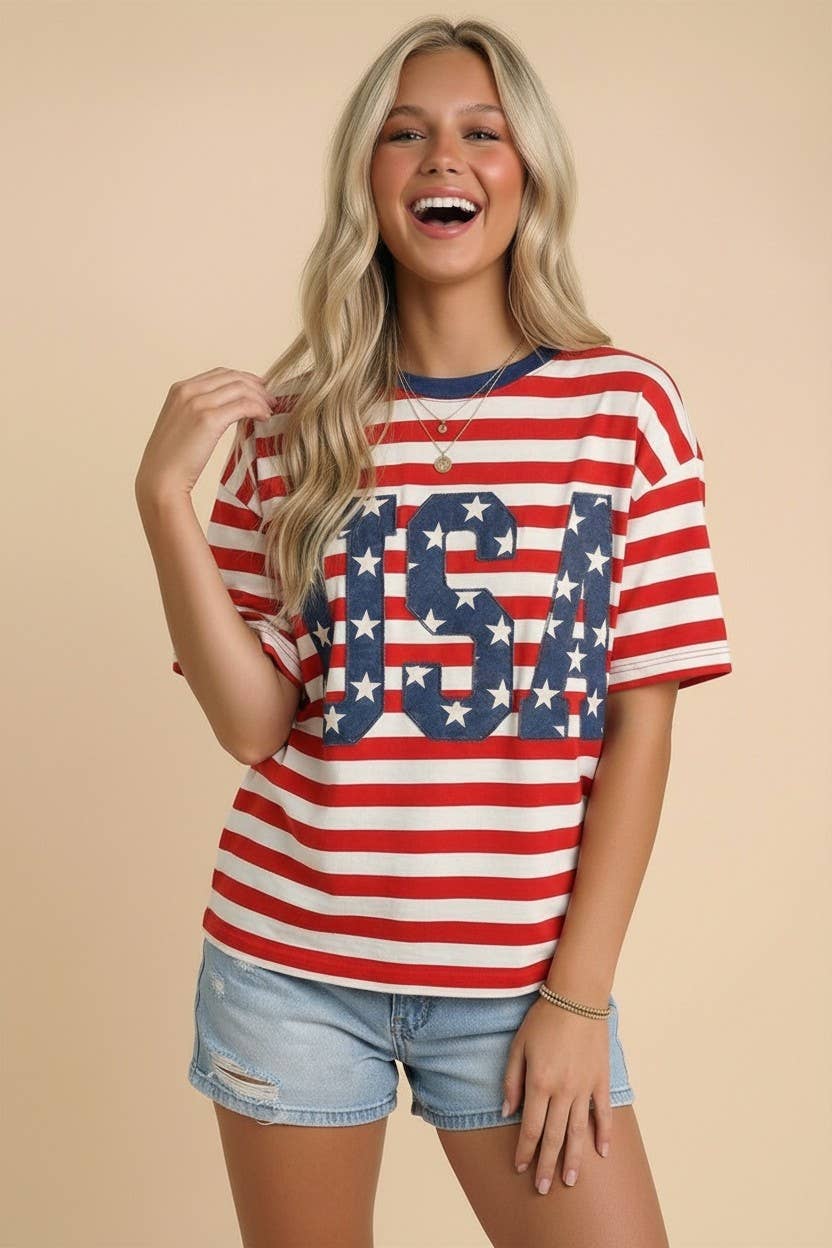 Woman wearing a red, white, and blue striped shirt with 'USA' design on a beige background
