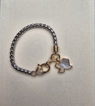 Bracelet with Texas charm on a light gray background