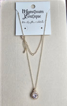 Necklace with pendant on a card from Mainstream Boutique