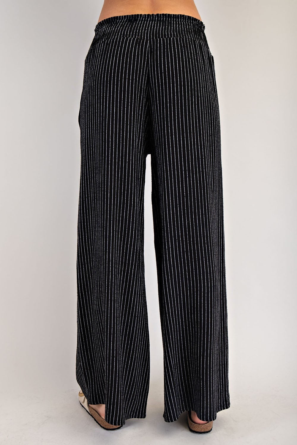 Black vertical pinstripe drawstring straight-leg pants, front view