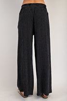 Black vertical pinstripe drawstring straight-leg pants, front view