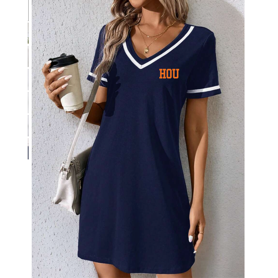 Woman wearing a navy blue dress with 'HOU' on it, holding a coffee cup.