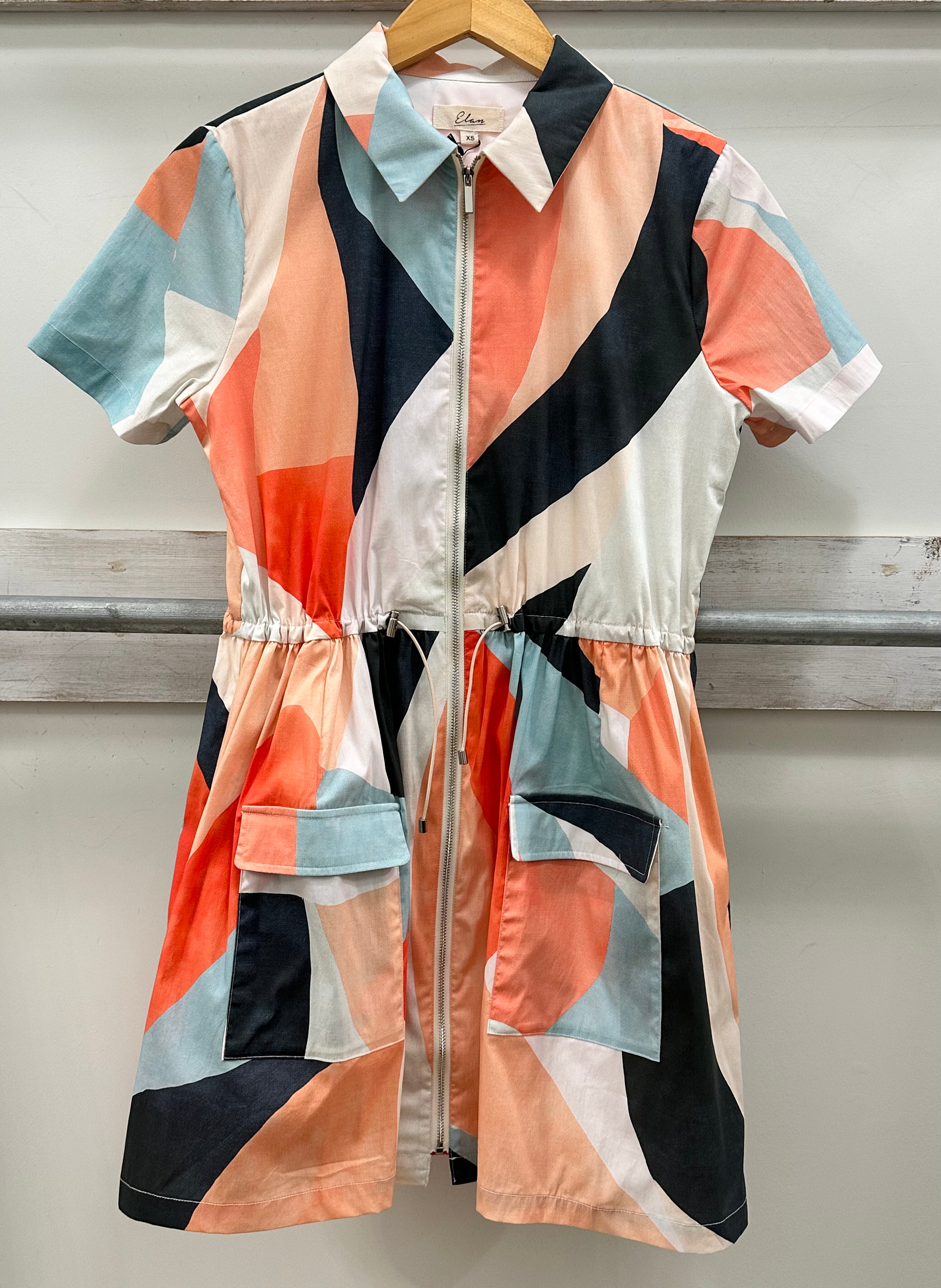 colorful patterned dress on a plain background