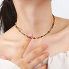 Multicolored beaded necklace being worn by a person
