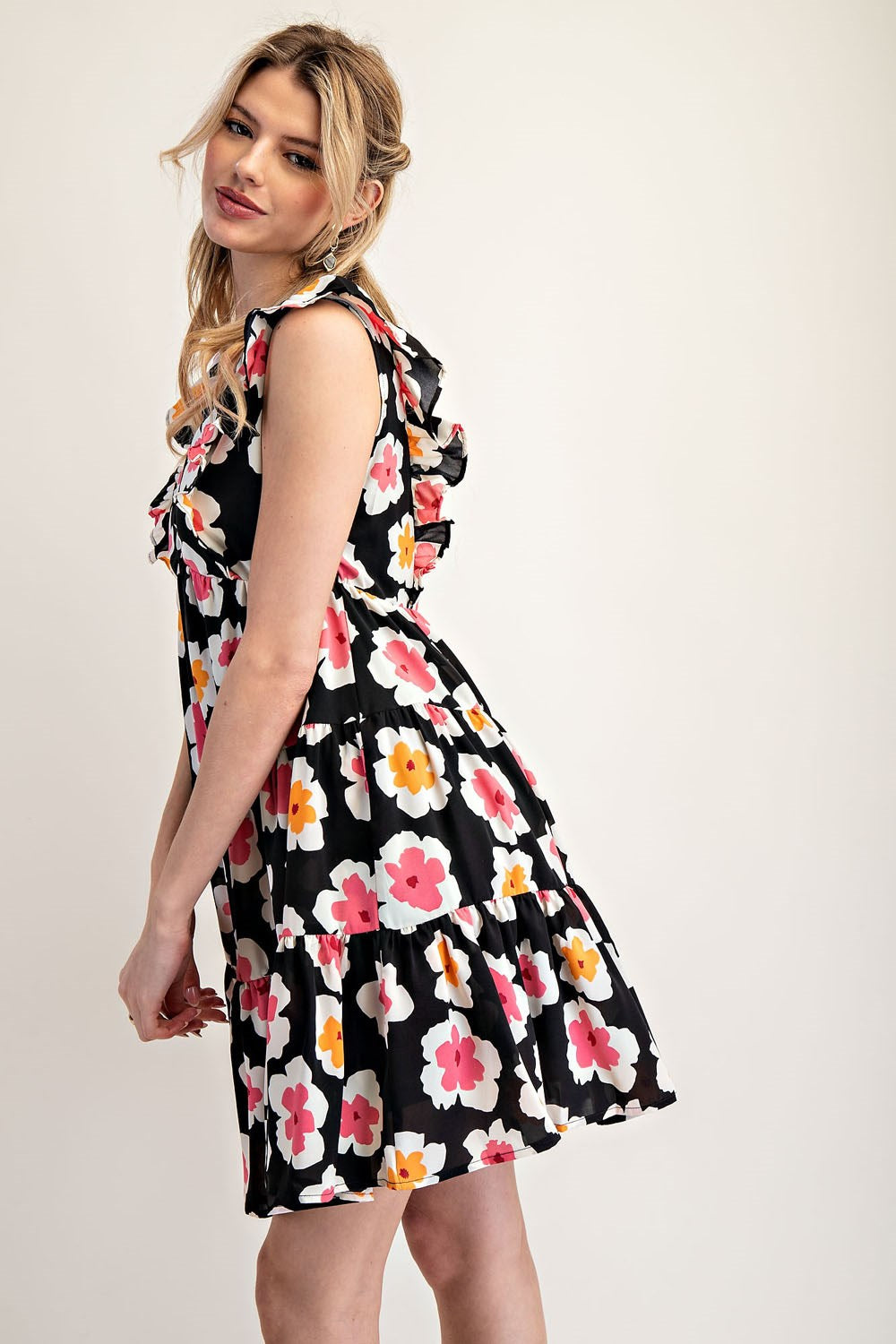 Woman wearing a floral dress on a white background
