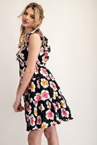 Woman wearing a floral dress on a white background