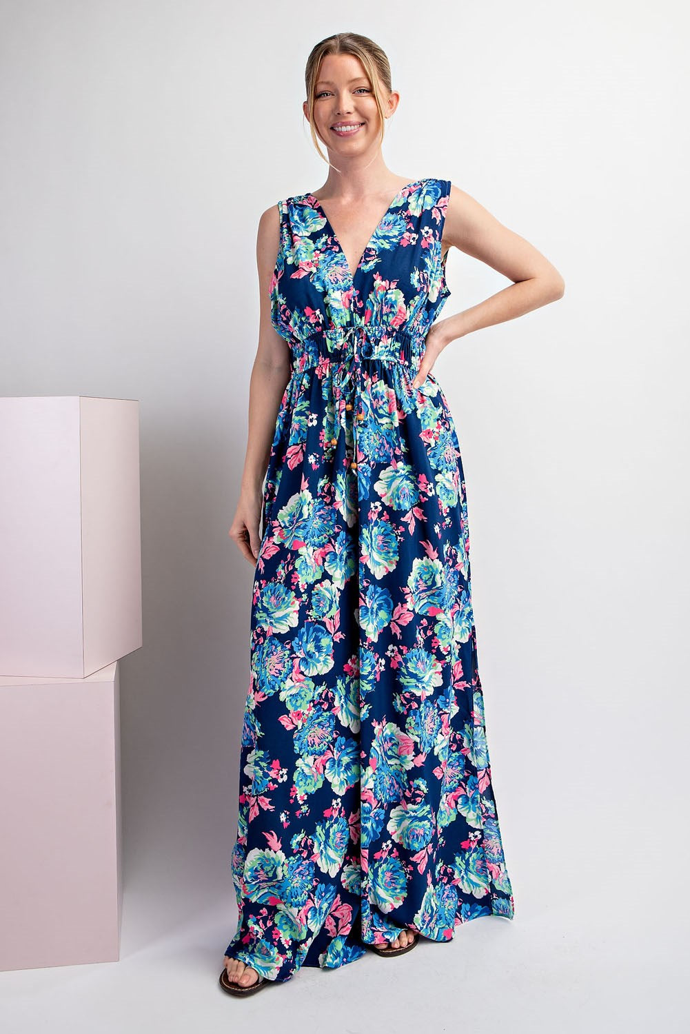 Woman wearing a floral dress on a white background