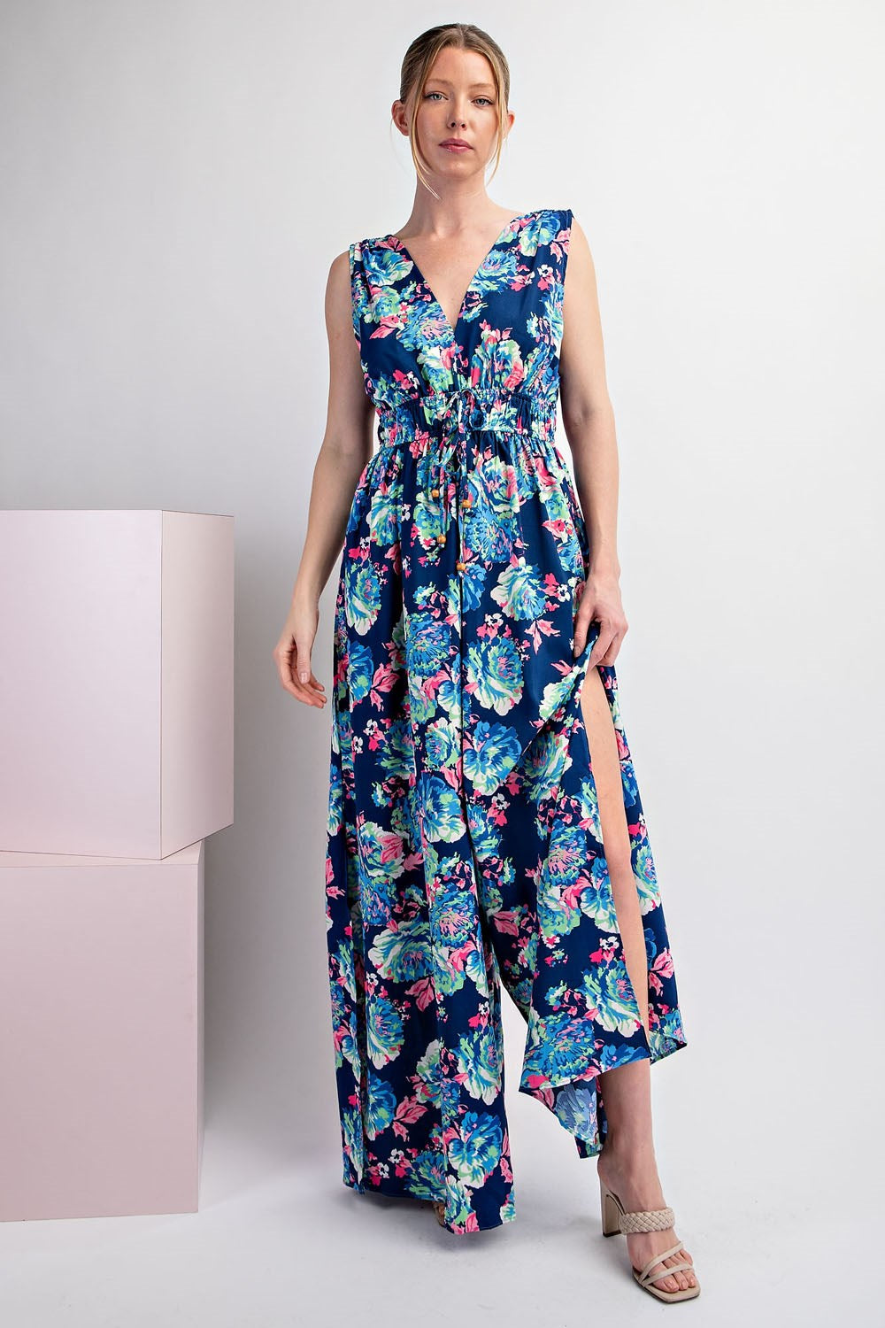 Woman wearing a floral dress with a white background