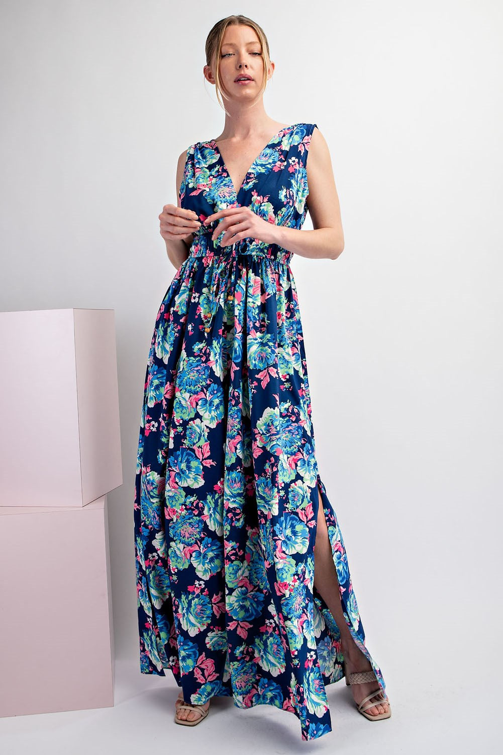 Woman wearing a floral dress with a white background