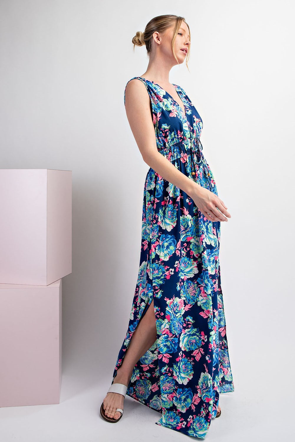 Woman wearing a floral dress with a white background