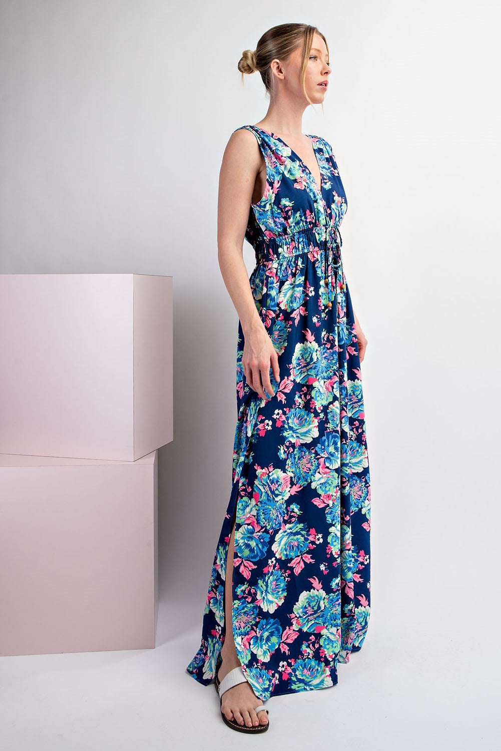 Woman wearing a floral dress on a white background
