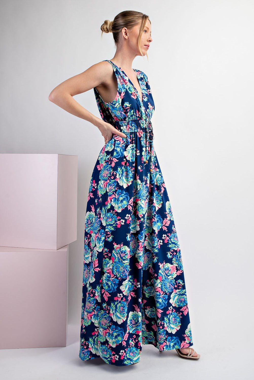Woman wearing a floral dress on a white background