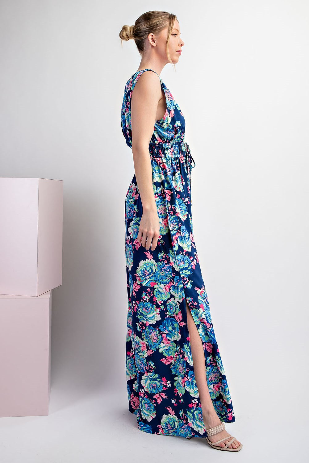 Woman wearing a floral dress with a white background