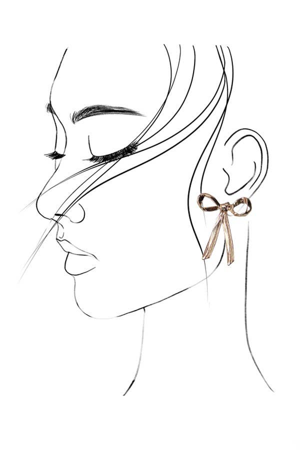 Line art of a woman's face with a detailed earring on a white background