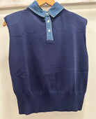 Blue sweater vest with denim collar on a hanger against a white background