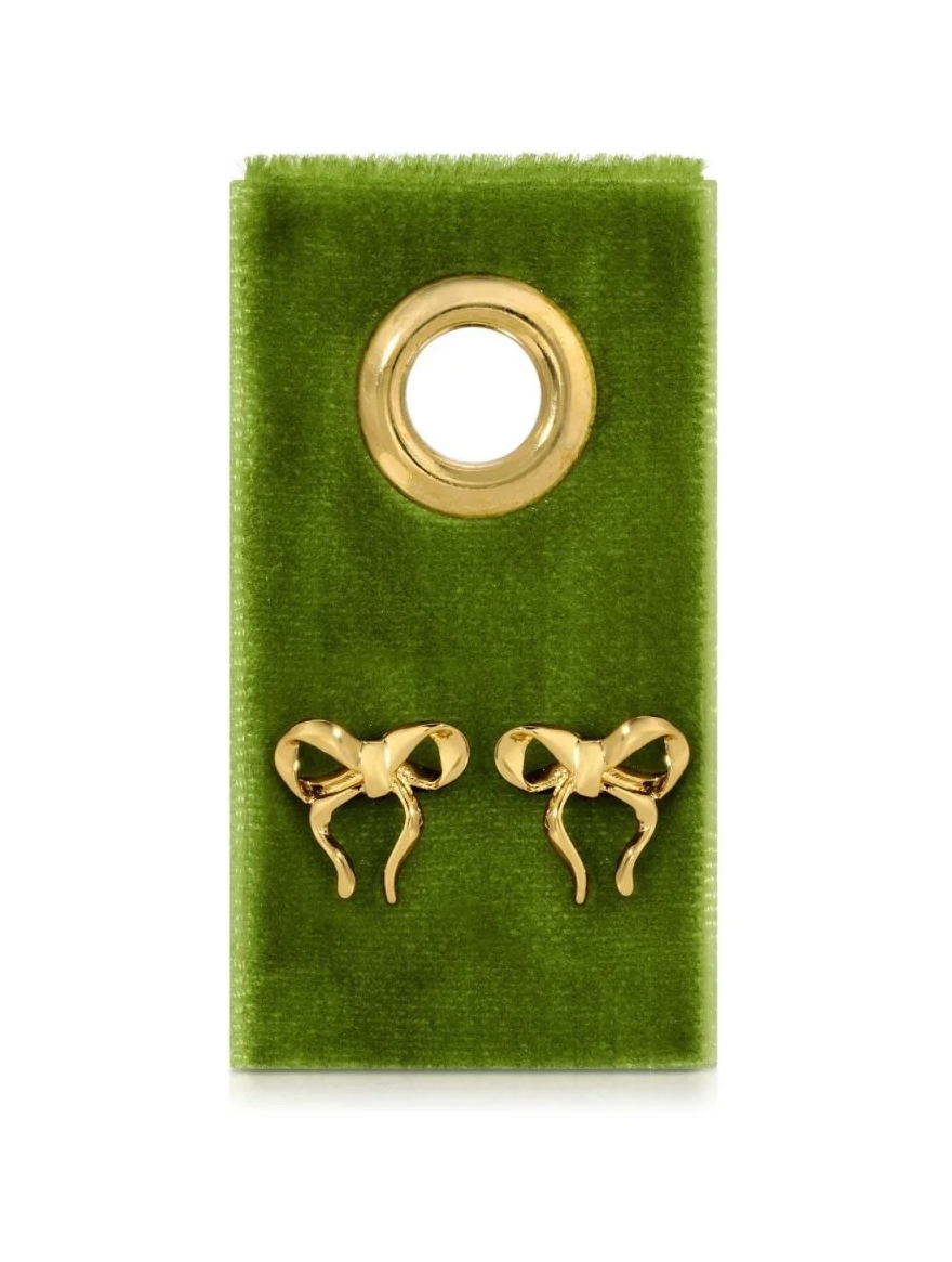 Gold bow-shaped earrings on a green card with a gold hoop