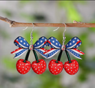 Cherry-themed earrings with American flag design on a branch