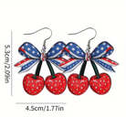 Earrings with American flag bow and cherries on a white background