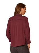 Back view of Scallop Trim Button Down Blouse in Fig Jam and black