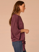 Front view of Fig Jam Multi floral dolman sleeve top with tie hem