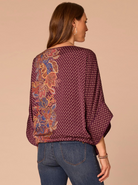 Side view of Fig Jam Multi dolman sleeve top