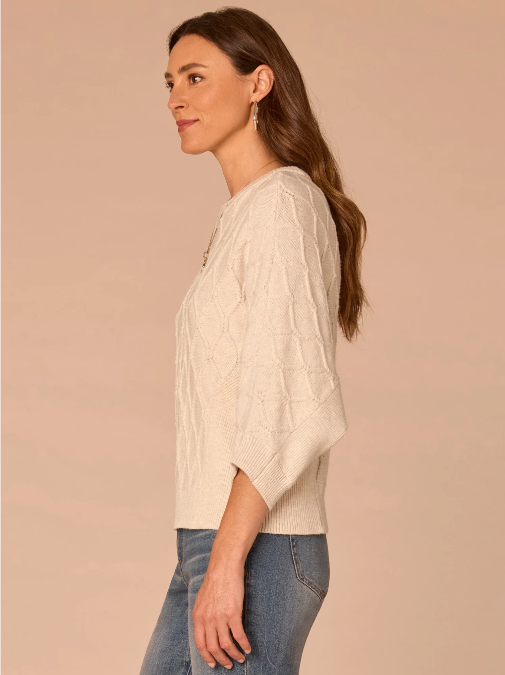 Front view of cream grid stitch dolman sleeve sweater