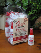 Sheeter Screen Personal Mosquito Deterrent packaging and bottles on a wooden surface with greenery in the background.